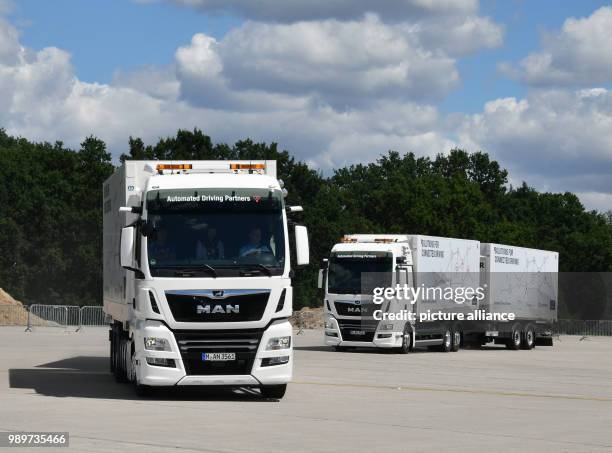 July 2018, Germany, Selchow: Trucks during a demonstration of platooning in autonomous driving in the unused south strip of Schoenefeld Airport....