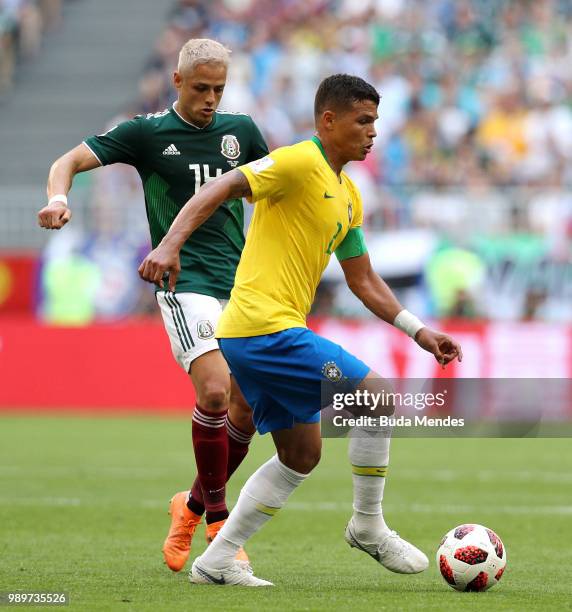 Thiago Silva of Brazil is challenged by Javier Hernandez of Mexico during the 2018 FIFA World Cup Russia Round of 16 match between Brazil and Mexico...