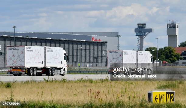 July 2018, Germany, Selchow: Trucks during a demonstration of platooning in autonomous driving in the unused south strip of Schoenefeld Airport....