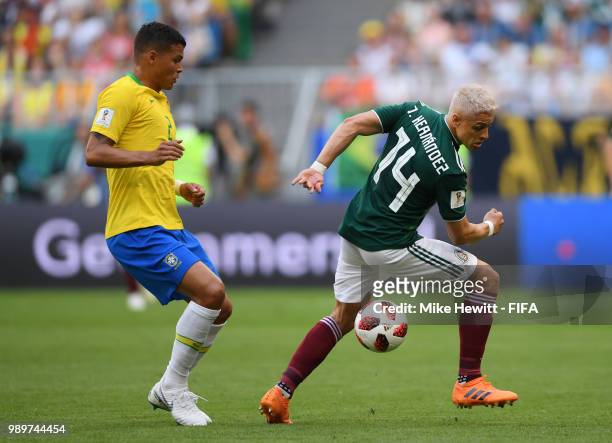 Thiago Silva of Brazil challenge for the ball with Javier Hernandez of Mexico during the 2018 FIFA World Cup Russia Round of 16 match between Brazil...
