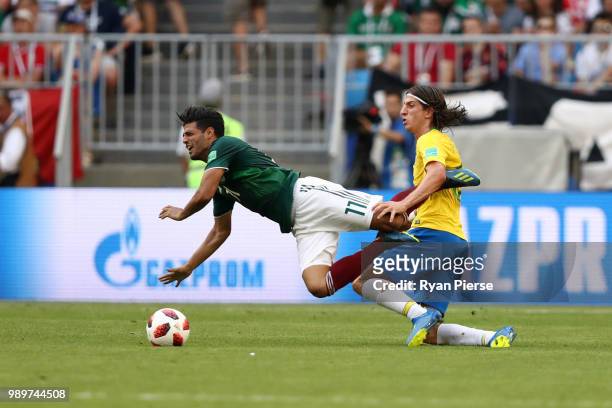 Carlos Vela of Mexico is fouled by Filipe Luis of Brazil during the 2018 FIFA World Cup Russia Round of 16 match between Brazil and Mexico at Samara...