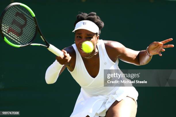 Venus Williams of the United States returns to Johanna Larsson of Sweden during their Ladies' Singles first round match on day one of the Wimbledon...