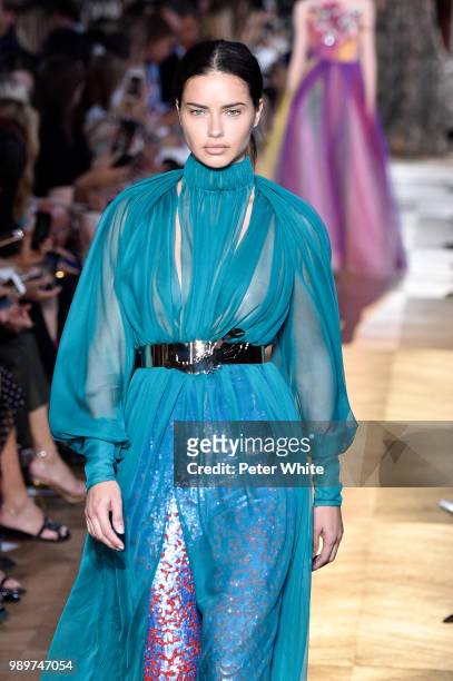 Adriana Lima walks the runway during the Schiaparelli Haute Couture Fall Winter 2018/2019 show as part of Paris Fashion Week on July 2, 2018 in...