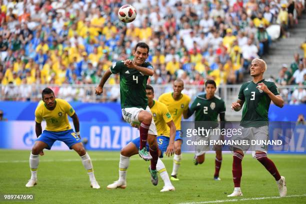 Mexico's midfielder Rafael Marquez jumps for the ball during the Russia 2018 World Cup round of 16 football match between Brazil and Mexico at the...