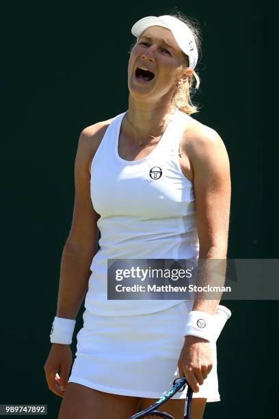 Ekaterina Makarova of Russia reacts during her Ladies' Singles first round match against Petra Martic of Croatia on day one of the Wimbledon Lawn...