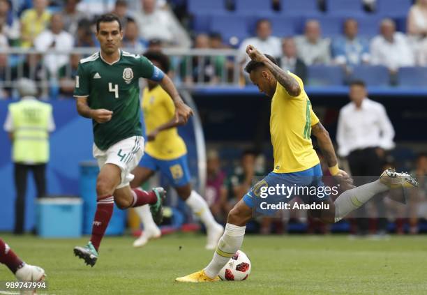 Rafael Marquez of Mexico in action against Neymar of Brazil during the 2018 FIFA World Cup Russia Round of 16 match between Brazil and Mexico at the...