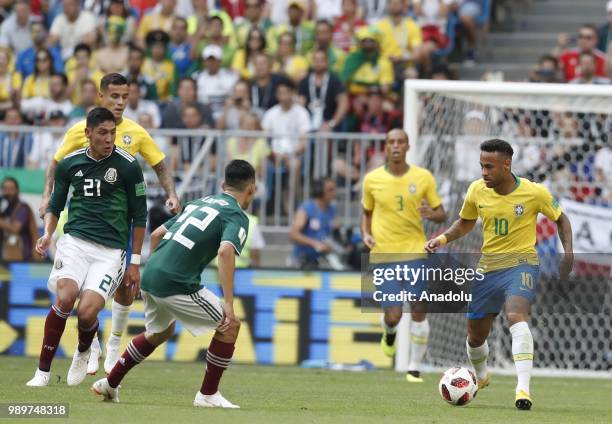 Neymar of Brazil in action against Edson Alvarez and Hirving Lozano of Mexico during the 2018 FIFA World Cup Russia Round of 16 match between Brazil...
