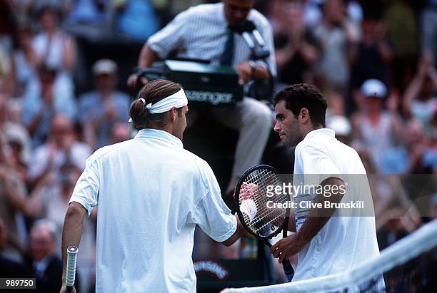 Pete Sampras of the USA congratulates Roger Federer of Switzerland following his victory during the men's fourth round of The All England Lawn Tennis...