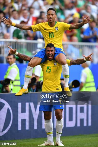 Neymar Jr of Brazil celebrates with teammate Paulinho after scoring his team's first goal during the 2018 FIFA World Cup Russia Round of 16 match...