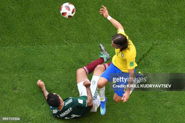 Mexico's midfielder Rafael Marquez vies with Brazil's defender Filipe Luis during the Russia 2018 World Cup round of 16 football match between Brazil...