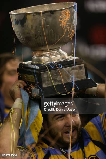 Horacio Agulla of Hindu celebrates with the trophy on his head at the end of the final match between Hindu and Newman as part of Argentina National...