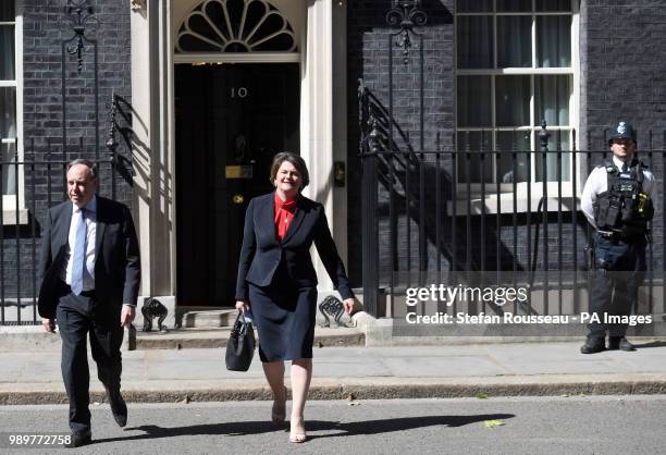 Arlene Foster, Leader of the Democratic Unionist Party, and the party's deputy leader, Nigel Dodds, leave Downing Street following a meeting with...