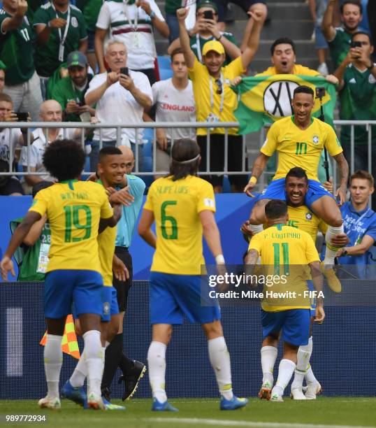 Neymar Jr of Brazil celebrates with teammates after scoring his team's first goal during the 2018 FIFA World Cup Russia Round of 16 match between...