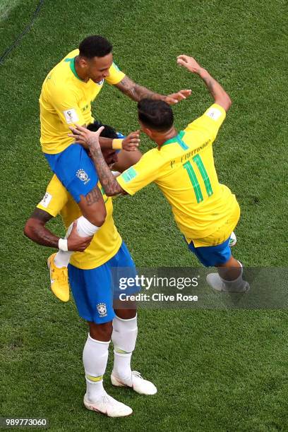 Neymar Jr of Brazil celebrates with teammates Paulinho and Philippe Coutinho after scoring his team's first goal during the 2018 FIFA World Cup...