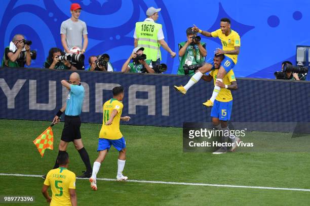 Neymar Jr of Brazil celebrates with teammate Paulinho after scoring his team's first goal during the 2018 FIFA World Cup Russia Round of 16 match...