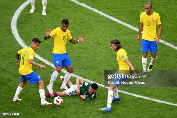 Hirving Lozano of Mexico is surrounded by Philippe Coutinho, Paulinho, Miranda and Filipe Luis of Brazil during the 2018 FIFA World Cup Russia Round...