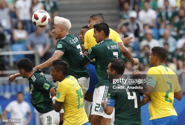 Willian and Thiago Silva of Brazil in action against Carlos Salcedo , Rafael Marquez and Miguel Layun of Mexico during the 2018 FIFA World Cup Russia...