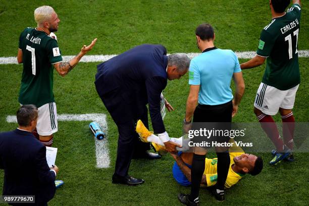 Neymar Jr of Brazil goes down injured during the 2018 FIFA World Cup Russia Round of 16 match between Brazil and Mexico at Samara Arena on July 2,...