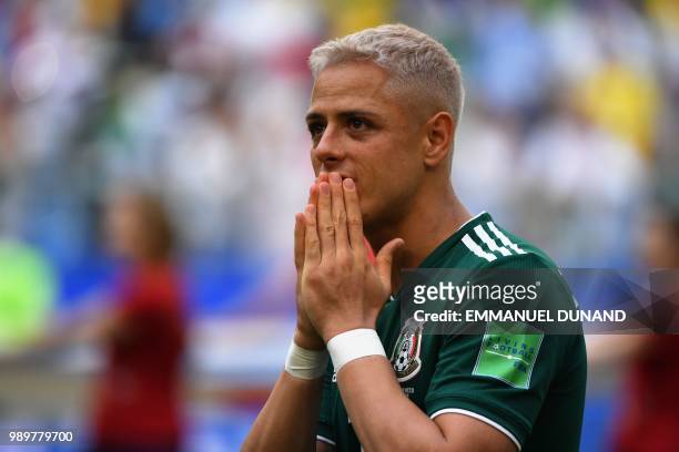 Mexico's forward Javier Hernandez reacts prior to the start of the Russia 2018 World Cup round of 16 football match between Brazil and Mexico at the...