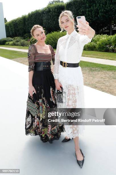 Kate Bosworth and Karlie Kloss attend the Christian Dior Haute Couture Fall Winter 2018/2019 show as part of Paris Fashion Week on July 2, 2018 in...