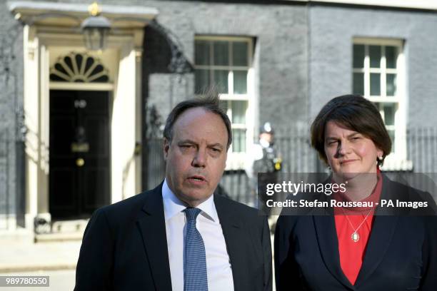 Arlene Foster, Leader of the Democratic Unionist Party, and the party's deputy leader, Nigel Dodds, leave Downing Street following a meeting with...