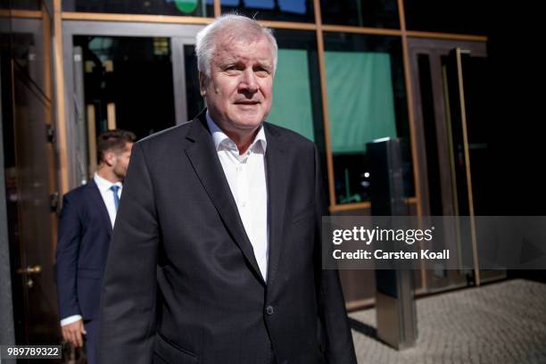 German Interior Minister and leader of the Bavarian Christian Democrats Horst Seehofer leaves the Bundestag after a meeting of the CDU governing...