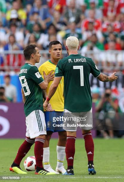 Philippe Coutinho of Brazil confronts Miguel Layun of Mexico during the 2018 FIFA World Cup Russia Round of 16 match between Brazil and Mexico at...