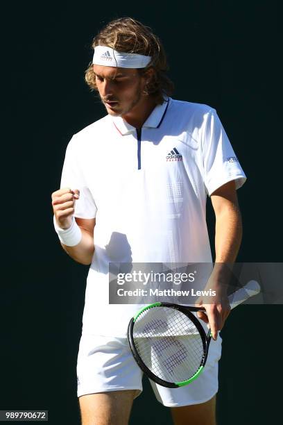 Stefanos Tsitsipas celebrates a point during his Men's Singles first round match against Gregoire Barrere of France on day one of the Wimbledon Lawn...