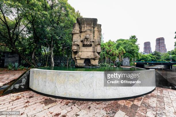 tlaloc statue at the entrance of the national museum of anthropology - calendario azteca fotografías e imágenes de stock