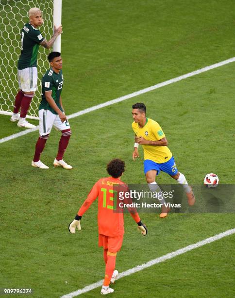 Roberto Firmino of Brazil celebrates after scoring his team's second goal during the 2018 FIFA World Cup Russia Round of 16 match between Brazil and...