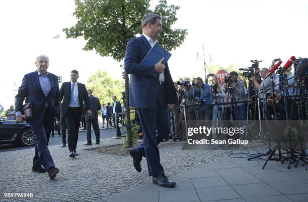 Markus Soeder , Governor of Bavaria and a leading member of the Bavarian Social Union , and Edmund Stoiber, former CSU leader, arrive shortly before...