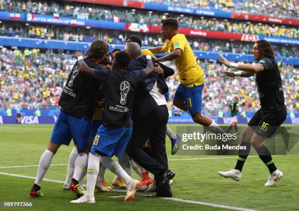 Roberto Firmino of Brazil celebrates with teammates after scoring his team's second goal during the 2018 FIFA World Cup Russia Round of 16 match...