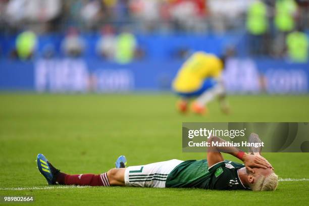 Miguel Layun of Mexico shows his dejection following the 2018 FIFA World Cup Russia Round of 16 match between Brazil and Mexico at Samara Arena on...