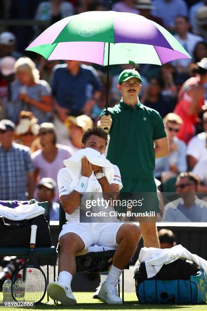 Stanislas Wawrinka of Switzerland reacts during his break in his Men's Singles first round match against Grigor Dimitrov of Bulgaria on day one of...