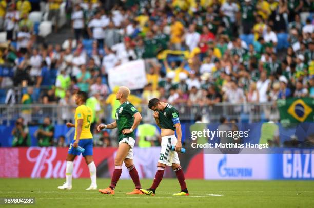 Javier Hernandez of Mexico and Andres Guardado of Mexico look dejected following their sides defeat in the 2018 FIFA World Cup Russia Round of 16...