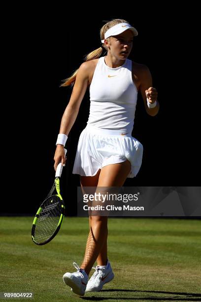 Katie Swan of Great Britain celebrates a point against Irina-Camelia Begu of Romania during their Ladies' Singles first round match on day one of the...