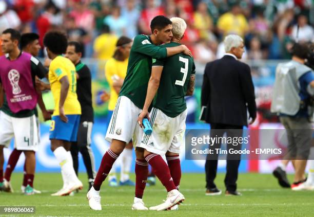 Mexico's Edson Alvarez embraces team-mate Carlos Salcedo after they are knocked out of the tournament Brazil v Mexico - FIFA World Cup 2018 - Round...