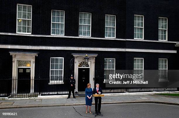 British Prime Minister Gordon Brown speaks to the media beside his wife Sarah as Brown resigns, in Downing Street on May 11, 2010 in London, England....