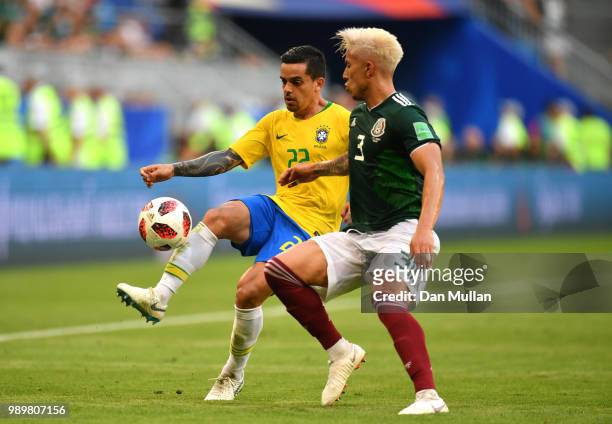 Fagner of Brazil is closed down by Carlos Salcedo of Mexico during the 2018 FIFA World Cup Russia Round of 16 match between Brazil and Mexico at...
