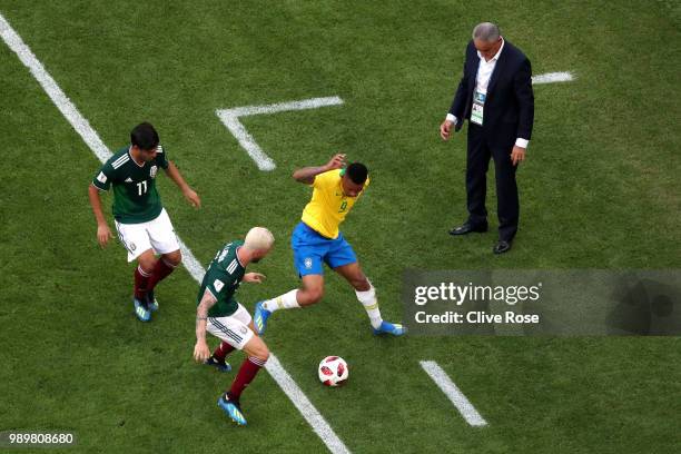 Neymar Jr of Brazil challenge for the ball with Miguel Layun and Carlos Vela during the 2018 FIFA World Cup Russia Round of 16 match between Brazil...