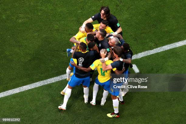 Roberto Firmino of Brazil celebrates with teammates after scoring his team's second goal during the 2018 FIFA World Cup Russia Round of 16 match...