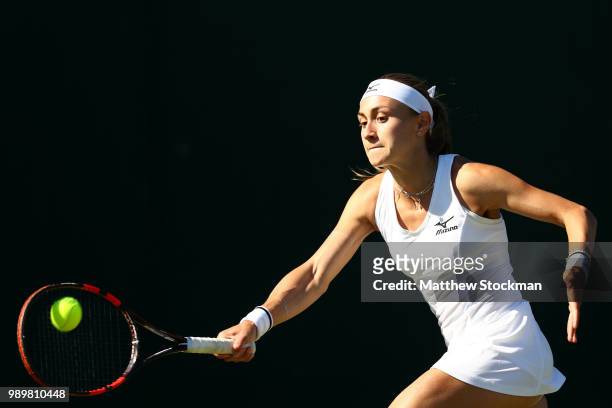 Aleksandra Krunic of Serbia returns against Madison Brengle of the United States during their Ladies' Singles first round match on day one of the...