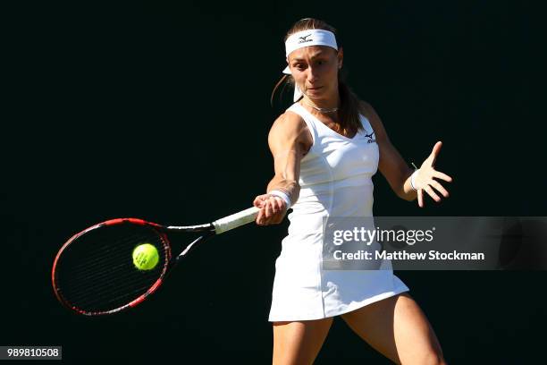 Aleksandra Krunic of Serbia returns against Madison Brengle of the United States during their Ladies' Singles first round match on day one of the...