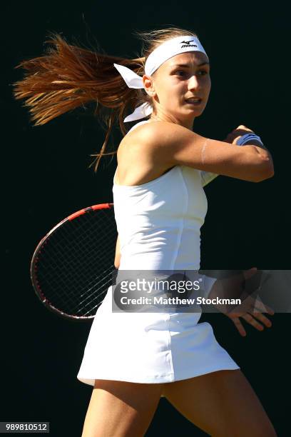 Aleksandra Krunic of Serbia returns against Madison Brengle of the United States during their Ladies' Singles first round match on day one of the...