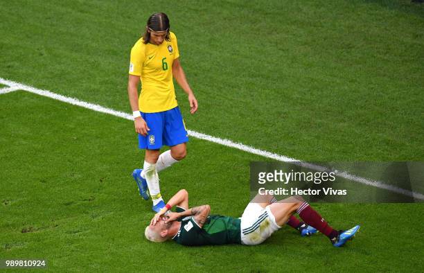 Filipe Luis of Brazil looks at Miguel Layun of Mexico liying injured during the 2018 FIFA World Cup Russia Round of 16 match between Brazil and...