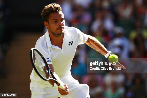 Stanislas Wawrinka of Switzerland returns against Grigor Dimitrov of Bulgaria during their Men's Singles first round match on day one of the...