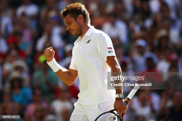 Stanislas Wawrinka of Switzerland celebrates a point against Grigor Dimitrov of Bulgaria during their Men's Singles first round match on day one of...