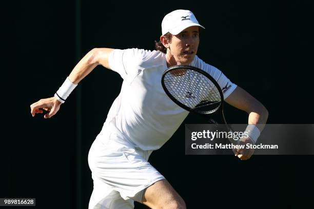 John-Patrick Smith of Australia runs to return against Andreas Seppi of Italy during their Men's Singles first round match on day one of the...