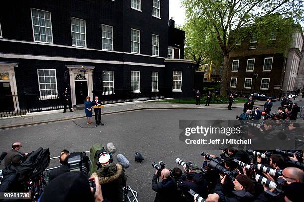 British Prime Minister Gordon Brown speaks to the media beside his wife Sarah as Brown resigns, in Downing Street on May 11, 2010 in London, England....