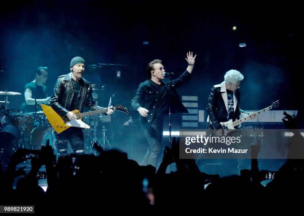 Larry Mullen Jr., The Edge, Bono and Adam Clayton of U2 perform on stage during the "eXPERIENCE & iNNOCENCE" tour at Madison Square Garden on July 1,...